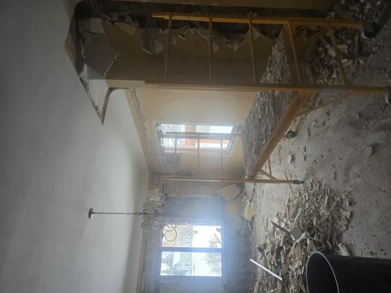 Room gutted to studs during renovation debris hauling