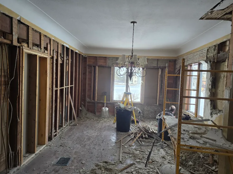 Demolition in progress — ceiling and walls removed during cleanout