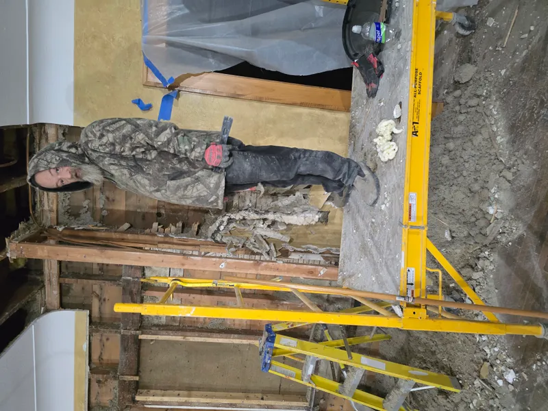 Exposed wall framing after drywall removal in Minneapolis home