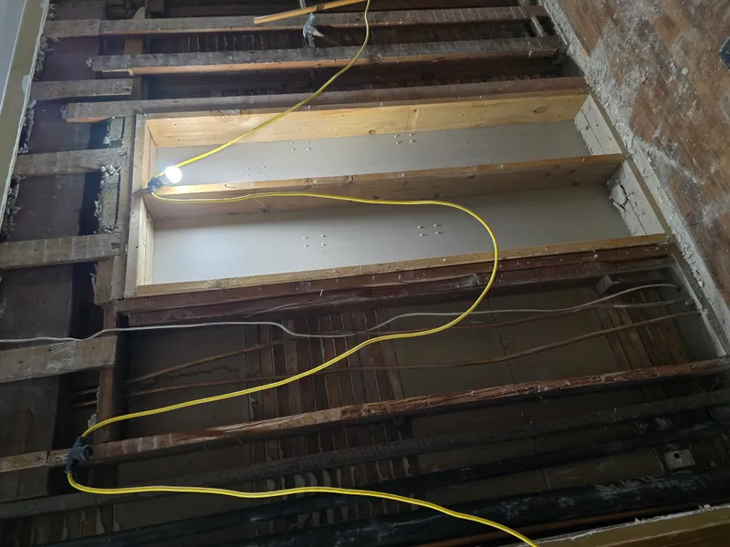 Floor joists exposed during renovation debris removal