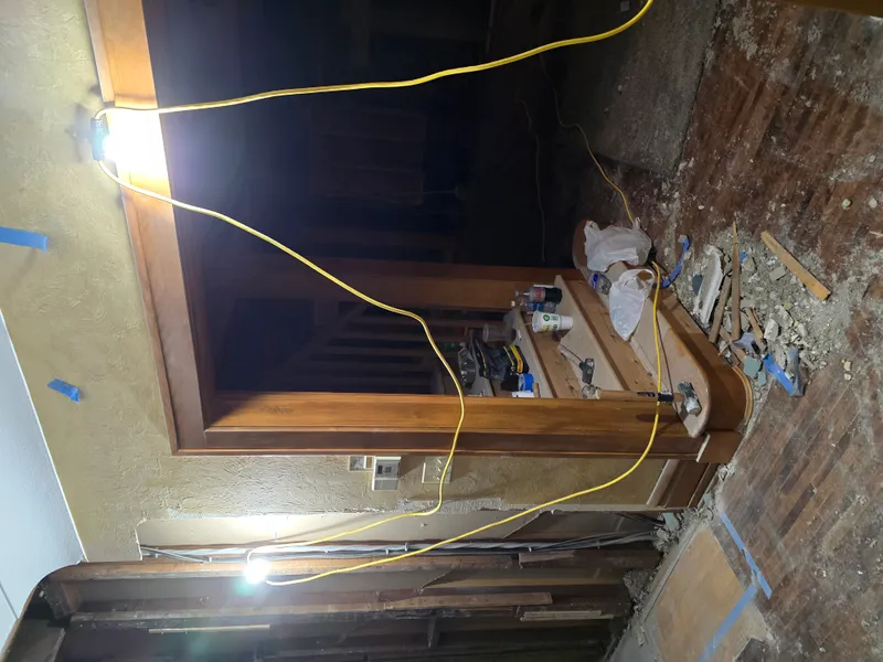 Interior demo debris with plaster and lath hauled away